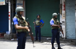 Soldiers stand guard outside St. Anthony's Shrine in Colombo on April 25, 2019, following a series of bomb blasts targeting churches and luxury hotels on the Easter Sunday in Sri Lanka. - All of Sri Lanka's Catholic churches have been ordered to stay closed and suspend services until security improves after deadly Easter bombings, which killed at least 359 people and wounded hundreds, a senior priest told AFP on April 25. (Photo by Jewel SAMAD / AFP)