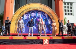 (L-R) President of Marvel Studios/Producer Kevin Feige, actors  Chris Hemsworth, Chris Evans, Robert Downey Jr., Scarlett Johansson, Mark Ruffalo and Jeremy Renner attends the Marvel Studios' 'Avengers: Endgame' cast place their hand prints in cement at TCL Chinese Theatre IMAX Forecourt on April 23, 2019, in Hollywood, California. (Photo by VALERIE MACON / AFP)