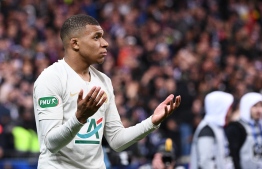 Paris Saint-Germain's French forward Kylian Mbappe leaves the pitch after receiving a red card during the French Cup final football match between Rennes (SRFC) and Paris Saint-Germain (PSG), on April 27, 2019 at the Stade de France in Saint-Denis, outside Paris. (Photo by Martin BUREAU / AFP)