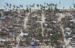 This handout aerial photograph taken and released on April 27, 2019 by the United Nations Office for the Coordination of Humanitarian Affairs (OCHA) shows the damaged communities in Macomia district, Mozambique, on April 27, 2019 following the destruction by Cyclone Kenneth. - Heavy rains from a powerful cyclone lashed northern Mozambique on April 27, 2019, sparking fears of flooding as aid workers arrived to assess the damage, just weeks after the country suffered one of the worst storms in its history. Cyclone Kenneth, a Category Three storm on the hurricane scale, made landfall in Mozambique's Cabo Delgado province late on April 25 after swiping the Comoros islands. It made landfall a day later, killing one person and wrecking thousands of homes. (Photo by SAVIANO ABREU / OCHA / AFP) / 