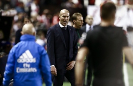 Real Madrid's French coach Zinedine Zidane reacts during the Spanish League football match between Rayo Vallecano and Real Madrid at the Vallecas Stadium in the Madrid district of Puente de Vallecas on April 28, 2019. (Photo by BENJAMIN CREMEL / AFP)