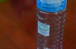 A bottle with the sticker used in Project 'Rahdhu'. Only bottles with this sticker are eligible for the incentive. PHOTO: HUSSAIN WAHEED / MIHAARU.