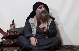 In this undated tv grab taken from a video released by Al-Furqan media, the chief of the Islamic State group Abu Bakr al-Baghdadi purportedly appears for the first time in five years in a propaganda video in an undisclosed location. - The elusive chief of the IS group al-Baghdadi has appeared for the first time in five years in a propaganda video released on April 29 by the jihadist organisation. It is unclear when the footage was filmed, but Baghdadi referred in the past tense to the months-long fight for Baghouz, IS's final bastion in eastern Syria, which ended last month. (Photo by - / various sources / AFP) / THIS PICTURE WAS MADE AVAILABLE BY A THIRD PARTY. AFP CAN NOT INDEPENDENTLY VERIFY THE AUTHENTICITY, LOCATION, DATE AND CONTENT OF THIS IMAGE. THIS PHOTO IS DISTRIBUTED EXACTLY AS RECEIVED BY AFP. RESTRICTED TO EDITORIAL USE - MANDATORY CREDIT "AFP PHOTO / SOURCE / AL-FURQAN" - NO MARKETING - NO ADVERTISING CAMPAIGNS - DISTRIBUTED AS A SERVICE TO CLIENTS / 