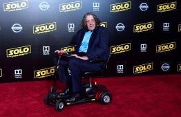(FILES) In this file photo taken on May 10, 2018 actor Peter Mayhew, who played the original Chewbacca, arrives for the premiere of the film 'Solo: A Star Wars Story' in Hollywood, California. - Actor Peter Mayhew, who won over fans worldwide as the Wookiee warrior Chewbacca in the blockbuster "Star Wars" movies, has died at the age of 74, his family announced on May 2, 2019. Mayhew died on Tuesday at his home in Texas, surrounded by loved ones, the family said in a statement released on the actor's Twitter account. (Photo by Frederic J. BROWN / AFP)