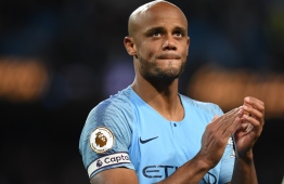 Manchester City's Belgian defender Vincent Kompany takes part in a lap of appreciation after the final whistle of the English Premier League football match between Manchester City and Leicester City at the Etihad Stadium in Manchester, north west England, on May 6, 2019. (Photo by Paul ELLIS / AFP) / RESTRICTED TO EDITORIAL USE. No use with unauthorized audio, video, data, fixture lists, club/league logos or 'live' services. Online in-match use limited to 120 images. An additional 40 images may be used in extra time. No video emulation. Social media in-match use limited to 120 images. An additional 40 images may be used in extra time. No use in betting publications, games or single club/league/player publications. / 