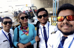 Mohamed Zaffan (2-R) and crew, after touching down on his maiden flight as captain. PHOTO: MIHAARU FILES