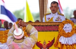 Thailand's King Maha Vajiralongkorn (R) presides the annual royal ploughing ceremony near the Grand Palace in Bangkok on May 9, 2019. (Photo by Krit Phromsakla Na SAKOLNAKORN / THAI NEWS PIX / AFP)