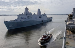 This handout picture released by the US Navy on December 19, 2018 shows the San Antonio-class amphibious transport dock ship USS Arlington (LPD 24) getting underway from Morehead City in North Carolina. - The Pentagon announced on May 10, 2019 that it is deploying the amphibious assault ship and a Patriot missile battery to the Middle East to bolster an aircraft carrier force sent to counter alleged threats from Iran. (Photo by MC3 Chris Roys / Navy Office of Information / AFP) / XGTY / RESTRICTED TO EDITORIAL USE - MANDATORY CREDIT "AFP PHOTO /US NAVY" - NO MARKETING NO ADVERTISING CAMPAIGNS - DISTRIBUTED AS A SERVICE TO CLIENTS