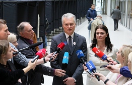 Lithuanian presidential candidate, economist Gitanas Nauseda, speaks to the media during an early vote, two days ahead of the presidential elections, at a polling station in Vilnius, Lithuania on May 10, 2019. - For all its economic growth, income inequality and poverty are top election issues as Lithuanians vote on May 12, 2019 for a new president in round one of a tight race in the Baltic eurozone state.
Nine candidates are vying to replace two-term independent incumbent Dalia Grybauskaite, but surveys show that only three stand any real chance of making it to the expected May 26 run-off coinciding with European parliament elections. (Photo by Petras Malukas / AFP)