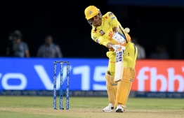 Chennai Super Kings cricket captain Mahendra Singh Dhoni plays a shot during the 2019 Indian Premier League (IPL) second qualifier Twenty20 cricket match between Delhi Capitals and Chennai Super Kings at the Dr. Y.S. Rajasekhara Reddy ACA-VDCA Cricket Stadium in Visakhapatnam on May 10, 2019. (Photo by NOAH SEELAM / AFP) / 