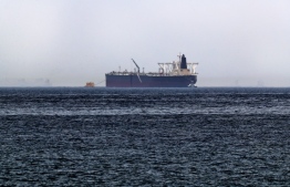 A picture taken on May 13, 2019, shows the crude oil tanker, Amjad, which was one of two Saudi tankers that were reportedly damaged in mysterious "sabotage attacks", off the coast of the Gulf emirate of Fujairah. - Saudi Arabia said two of its oil tankers were damaged in mysterious "sabotage attacks" in the Gulf as tensions soared in a region already shaken by a standoff between the United States and Iran. (Photo by KARIM SAHIB / AFP)