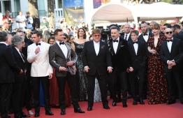 (FromL) British director Dexter Fletcher, British actor Richard Madden, British actor Taron Egerton, British singer-songwriter Elton John, his husband Canadian producer David Furnish, British Actor Kit Connor, US actress Bryce Dallas Howard and British songwriter Bernie Taupin arrive for the screening of the film "Rocketman" at the 72nd edition of the Cannes Film Festival in Cannes, southern France, on May 16, 2019. (Photo by LOIC VENANCE / AFP)
