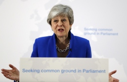 Britain's Prime Minister Theresa May delivers a speech in central London on May 21, 2019. - British Prime Minister Theresa May on Tuesday outlined a series of incentives for MPs to support her Brexit deal, saying there was "one last chance" to end the deadlock. May called the draft legislation going before MPs next month a "new Brexit deal" to end the current political impasse which has delayed Brexit. (Photo by Kirsty Wigglesworth / POOL / AFP)