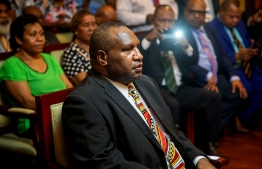 James Marape waits to be sworn in as the new Prime Minister of Papua New Guinea by Governor General Bob Dadae in Port Moresby on May 30, 2019. - Marape won the landslide backing of members of parliament after weeks of political manoeuvring that saw eight-year prime minister Peter O'Neill resign. (Photo by Vanessa Kerton / AFP)