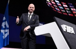 FIFA President Gianni Infantino poses for a picture after being re-elected by acclamation for a second term at the 69th FIFA Congress at Paris Expo, Porte de Versailles in Paris on June 5, 2019. - The 49 year-old, who took charge of FIFA in February 2016 after the departure of the disgraced Sepp Blatter, stood unopposed for re-election for a new four-year term which will run until 2023. (Photo by FRANCK FIFE / AFP)