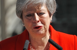 Britain's Prime Minister Theresa May reacts as she announces her resignation outside 10 Downing street in central London on May 24, 2019. - Beleaguered British Prime Minister Theresa May announced on Friday that she will resign on June 7, 2019 following a Conservative Party mutiny over her remaining in power. (Photo by Tolga AKMEN / AFP)