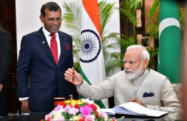 June 8, 2019, People's Majilis, Male' City: Indian Prime Minister Narendra Modi signs the guest book after he arrives to address the Maldivian parliament. PHOTO: HUSSAIN WAHEED/MIHAARU