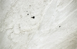 This handout photo released by the Indo-Tibetan Border Police on June 3, 2019, shows an aerial view of equipment and bodies partially buried in snow taken from a helicopter near the unclimbed peak where the 8 missing mountaineers were reported heading towards Nanda Devi East in the northern Indian state of Uttarakhand in India. - A helicopter searching for eight climbers missing on India's second-highest peak spotted five bodies on June 3, officials said. (Photo by Handout / Indo Tibetan Border Police / AFP) / 
