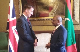 Minister Abdulla Shahid (R) discussed Maldives rejoining Commonwealth and the issue of climate change with the UK Foreign Secretary Jeremy Hunt. PHOTO: FOREIGN MV