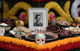 (FILES) This file picture taken on October 31, 2017 shows a detail of an altar dedicated to Mexican artist Frida Kahlo at the Frida Kahlo Museum in Mexico City. - Cultural authorities in Mexico said on June 12, 2019 that they believe -though not 100 percent sure- they have found the first recording of the iconic painter Frida Kahlo (1907-1954) reading a text she wrote in 1949 for her husband, muralist Diego Rivera. Culture Minister Alejandra Frausto said the discovery of the recording is part of the collection of Alvaro "El Bachiller" Galvez y Fuentes, an important figure of the "Golden Age" of Mexican radio. (Photo by Yuri CORTEZ / AFP)