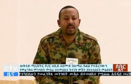 In this handout videograb released by the Ethiopian TV broadcast, Ethiopia's Prime Minister Abiy Ahmed addresses the public on television on June 23, 2019 after a failed coup. - Ethiopia's army chief and the president of a key region have been shot dead in a wave of violence highlighting the political instability in the country as Prime Minister Abiy Ahmed tries to push through reforms. (Photo by HO / Ethiopian TV / AFP) / RESTRICTED TO EDITORIAL USE - MANDATORY CREDIT "AFP PHOTO / Ethiopian TV / BYLINE" - NO MARKETING NO ADVERTISING CAMPAIGNS - DISTRIBUTED AS A SERVICE TO CLIENTS --- NO ARCHIVE ---