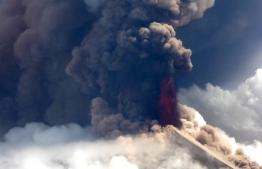 This handout from Niugini Helicopters taken and recieved on June 26, 2019 shows Papua New Guinea's Mount Ulawun volcano spewing lava. - Papua New Guinea's volatile Ulawun volcano -- designated one of the world's most hazardous -- erupted on June 26, spewing lava high in the air and sending residents fleeing. (Photo by Craig Powell / Niugini Helicopters / AFP) / -----EDITORS NOTE --- RESTRICTED TO EDITORIAL USE - MANDATORY CREDIT "AFP PHOTO / CRAIG POWELL / NIUGINI HELICOPTERS " - NO MARKETING - NO ADVERTISING CAMPAIGNS - DISTRIBUTED AS A SERVICE TO CLIENTS  - NO ARCHIVE
