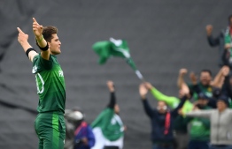 Pakistan's Shaheen Shah Afridi celebrates after the dismissal of New Zealand's Ross Taylor during the 2019 Cricket World Cup group stage match between New Zealand and Pakistan at Edgbaston in Birmingham, central England, on June 26, 2019. (Photo by Paul ELLIS / AFP) / 