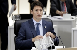 Justin Trudeau, Canada's prime minister, attends a working lunch at the G20 summit in Osaka on June 28, 2019. (Photo by Kiyoshi Ota / POOL / AFP)