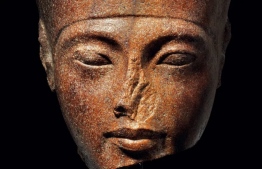 The 3,000-year-old stone bust of Tutankhamun was sold at an auction following controversy over its origins CREDIT: AFP