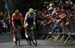 Belgian rider Greg Van Avermaet (L) and Belgian rider Xandro Meurisse lead a breakaway in the first stage of the 106th edition of the Tour de France cycling race between Brussels and Brussels, Belgium, on July 6, 2019. (Photo by Marco Bertorello / AFP)