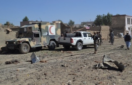 Afghan security personnel arrive at the site of a car bomb attack that targeted an intelligence unit in Ghazni on July 7, 2019. - A Taliban car bomb in eastern Afghanistan killed at least five people and wounded scores more on July 7, 2019, Afghan officials said, in a blast that came amid ongoing peace talks in Qatar. (Photo by STR / AFP)