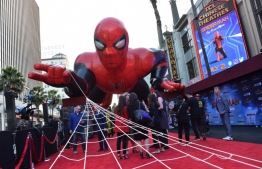(FILES) In this file photo taken on June 26, 2019 a giant inflatable Spider-Man is displayed on the red carpet for the “Spider-Man: Far From Home” World premiere at the TCL Chinese theatre in Hollywood. Once again Spider-Man seems to be trapping everything that flies by: "Spider-Man: Far From Home" took in an impressive $93.6 million in North America over the US holiday weekend and has passed the half-billion-dollar mark worldwide, industry watcher Exhibitor Relations estimated on July 7, 2019. This latest in the Spider-Man franchise, made by Sony and Disney-owned Marvel, set a record six-day total for a Tuesday release of $185.1 million, according to the Hollywood Reporter. 
Chris Delmas / AFP