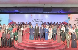President Ibrahim Mohamed Solih and top officials of the government posing for a picture with students who received awards at the Top Achievers Awards '18. PHOTO: NISHAN ALI/ MIHAARU