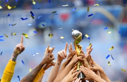 USA's players celebrate with the trophy after the France 2019 Women’s World Cup football final match between USA and the Netherlands, on July 7, 2019, at the Lyon Stadium in Lyon, central-eastern France. 
Philippe DESMAZES / AFP