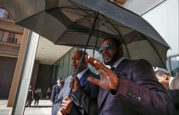 (FILES) In this file photo taken on June 26, 2019 R. Kelly leaves the Leighton Criminal Court Building after a hearing on sexual abuse charges in Chicago, Illinois. - R&B superstar R. Kelly has been arrested on suspicion of having sex with five underage girls, recording some of it on video tapes, and then attempting to hide the evidence, US prosecutors said on July 12, 2019. (Photo by KAMIL KRZACZYNSKI / AFP)