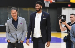 Los Angeles Lakers NBA basketball team general manager Rob Pelinka (L) walks with forward Anthony Davis (R) as he is introduced by his new team, the Los Angeles Lakers at his press event in El Segundo, California on July 13, 2019. - The Los Angeles Lakers acquired Anthony Davis from the New Orleans Pelicans. (Photo by Mark RALSTON / AFP)