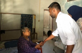 Mickail Naseem visiting houses to meet people of the constituency.  PHOTO: MDP Youth Wing