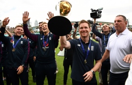 England's Jason Roy (L), England's Liam Plunkett (2L), England's Joe Root (3L) and England's captain Eoin Morgan attend a World Cup victory event at The Oval in London on July 15, 2019, a day after they won the 2019 Cricket World Cup final against New Zealand. - England won the World Cup for the first time ever on Sunday, holding their nerve to seal a thrilling Super Over victory against New Zealand after the final ended in a tie. Eoin Morgan's side finished on 241 all out in pursuit of New Zealand's 241-8, sending the match at Lord's to a six-ball shootout for each side. (Photo by Daniel LEAL-OLIVAS / AFP) / 