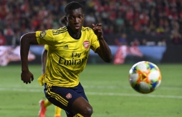 Forward Eddie Nketiah of Arsenal chases the ball against Bayern Munich during their International Champions Cup game at the Dignity Health Stadium in Carson, California on July 17, 2019. - Arsenal went on to win 2-1. (Photo by Mark RALSTON / AFP)