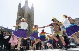 A number of morris dancing teams joined the protest outside Parliament (AFP Photo/Niklas HALLE'N)