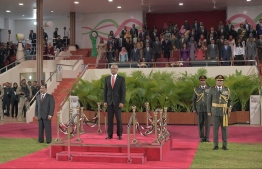 President Solih watching the troops display and the Presidential Salutation in his honour during the Independence Day celebrations. PHOTO: PRESIDENTS OFFICE