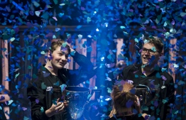 Emil "Nyhrox" Bergquist Pedersen (L) and Thomas "Aqua" Arnould pose with their trophies after winning the Duos competition during the 2019 Fortnite World Cup Finals - Round Two, on July 27, 2019, at Arthur Ashe Stadium, in New York City. (Photo by Johannes EISELE / AFP)