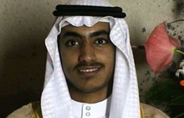 (FILES) In this file photo taken on November 01, 2017 An undated file video grab released by the Central Intelligence Agency (CIA) on November 1, 2017 and taken by researchers from the Federation for Defense of Democracies' Long War Journal, shows an image from the wedding of killed Al-Qaeda leader Osama Bin Laden's son Hamza. US President Donald Trump on Saturday confirmed that Hamza bin Laden, the son and designated heir of Al-Qaeda founder Osama bin Laden, was killed in a counter-terrorism operation along the Afghanistan-Pakistan border. PHOTO: AFP