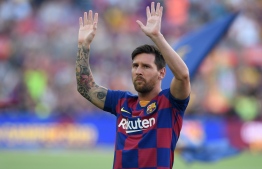 Barcelona's Argentinian forward Lionel Messi waves before the 54th Joan Gamper Trophy friendly football match between Barcelona and Arsenal at the Camp Nou stadium in Barcelona on August 4, 2019. PHOTO: JOSEP LAGO / AFP
