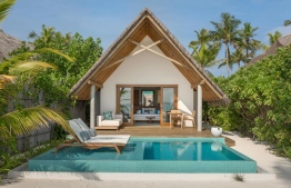 A beach villa in Fushifaru Maldives Resort --