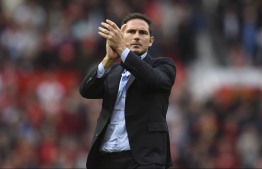 Chelsea's English head coach Frank Lampard applauds supporters on the pitch at the final whistle in the English Premier League football match between Manchester United and Chelsea at Old Trafford in Manchester, north west England, on August 11, 2019. - Manchester United won the game 4-0. PHOTO: OLI SCARFF / AFP