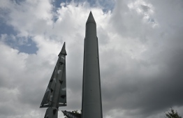 Replicas of a North Korean Scud-B missile (R) and South Korea's Nike missile (L) are displayed at the Korean War Memorial in Seoul on August 16, 2019. - North Korea fired two unidentified projectiles into the sea on August 16, and launched a scathing attack on "foolish" calls for dialogue from South Korean President Moon Jae-in. (Photo by Jung Yeon-je / AFP)