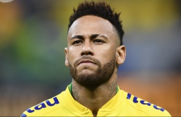 (FILES) In this file photo taken on June 6, 2019 shows Brazil's Neymar warming up before a friendly football match against Qatar at the Mane Garrincha stadium in Brasilia, ahead of Brazil 2019 Copa America. - Neymar was included on August 16, 2019 in Brazil's squad for friendlies against Colombia and Peru next month amid speculation of a departure from Paris Saint-Germain and a return to La Liga. (Photo by EVARISTO SA / AFP)