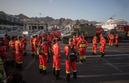 Members of the Spanish Army Emergency Military Unit prepare to travel by boat from Tenerife to the island of Gran Canaria to participate in the extinction of a new forest fire in the town of Valleseco on August 17, 2019. - Authorities in the Spanish island of Gran Canaria were evacuating a luxury hotel and tourist spot as a new forest fire broke out just days after another blaze raged in the same area. PHOTO: DESIREE MARTIN / AFP)