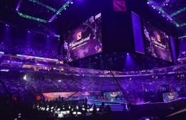 This general view shows the opening ceremony of the International Dota 2 Championships in Shanghai on August 20, 2019. - A record 33.5 million USD is up for grabs but professional eSports players like those competing in The International in Shanghai in mid August, pay a physical price with deteriorating eyesight, digestive problems and wrist and hand damage. (Photo by STR / AFP) / 